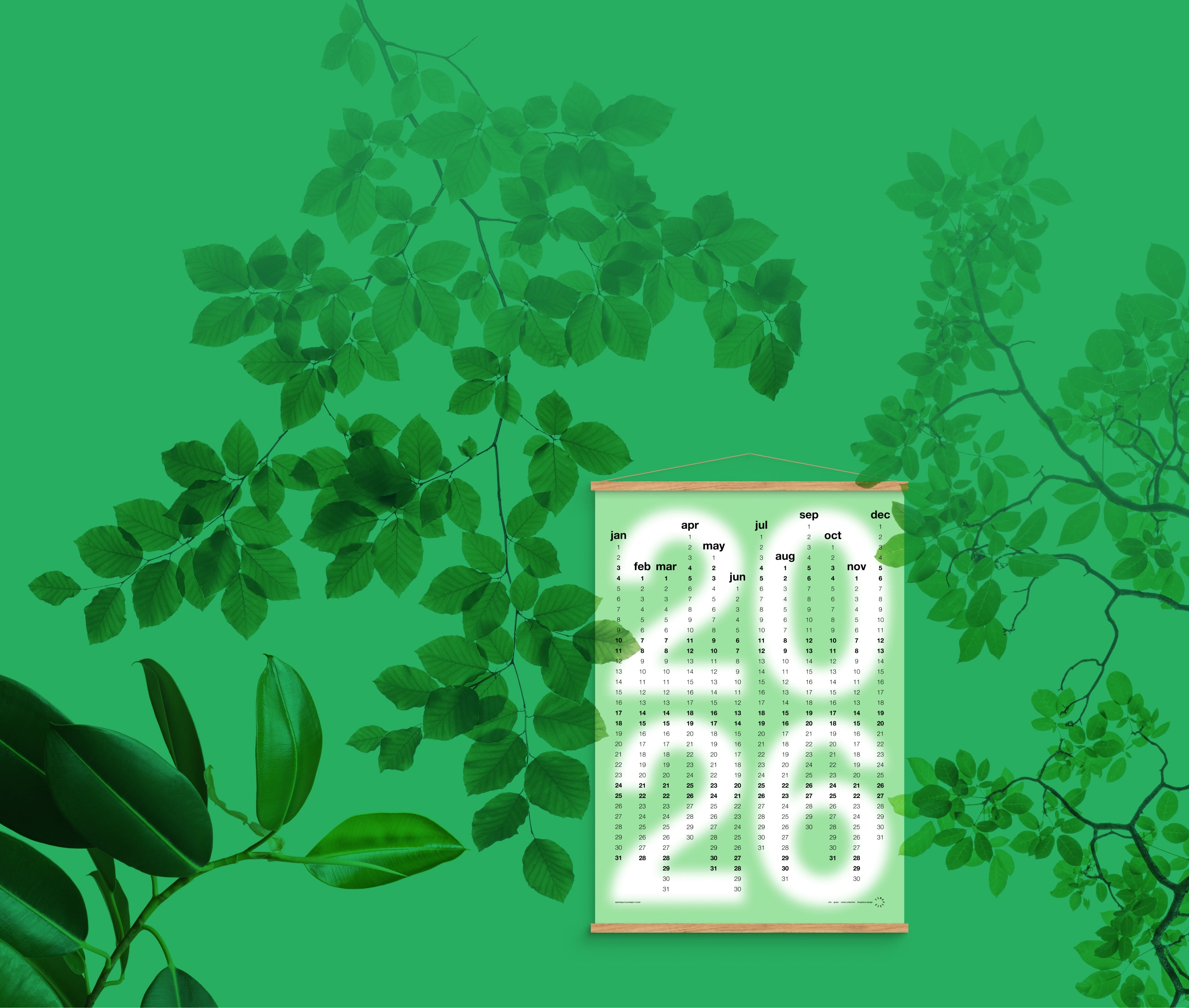 Calendar for 2026 hanging among green leaves on a green background