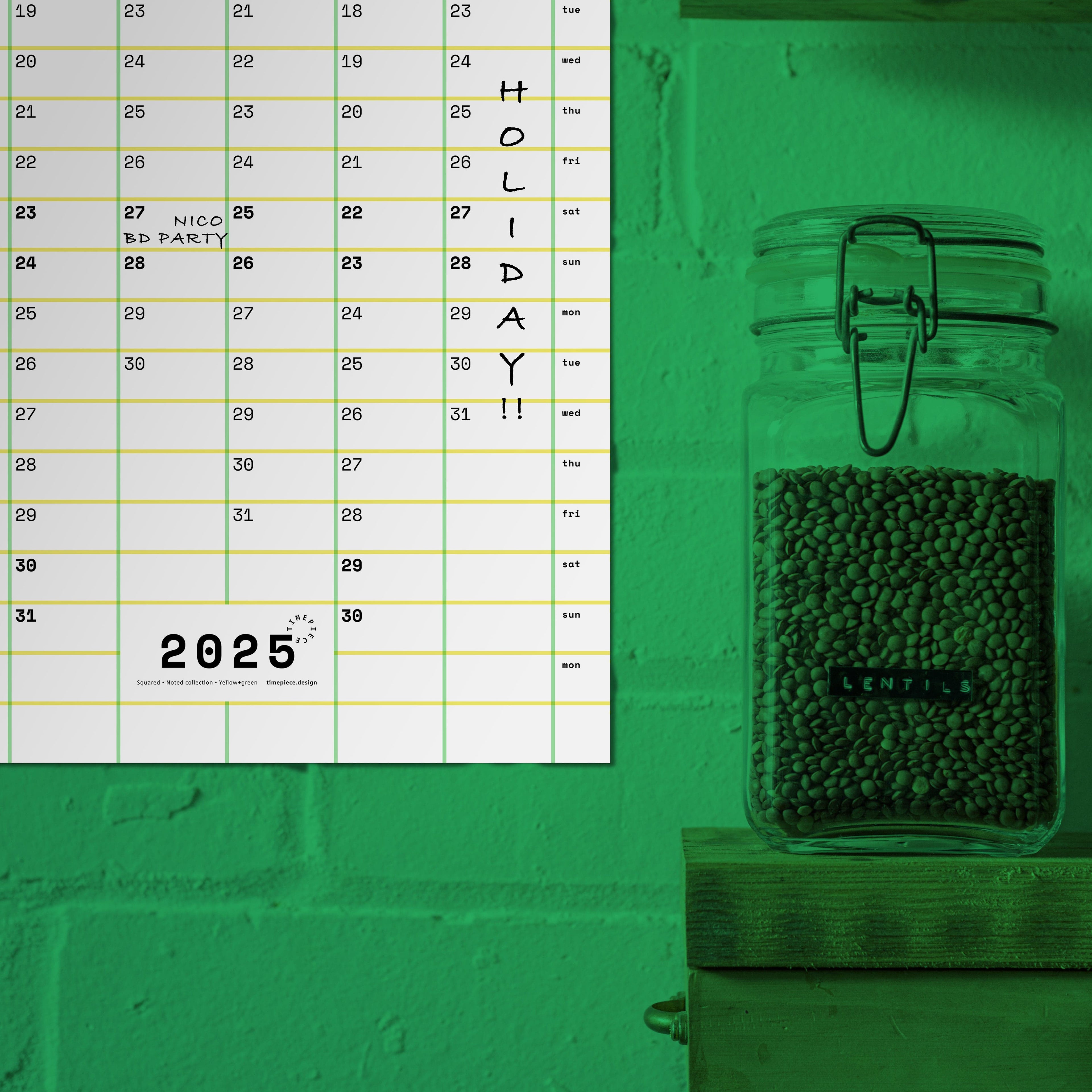 Close-up of Squared, yearly planner, over green-tinted wall, showing personal notes