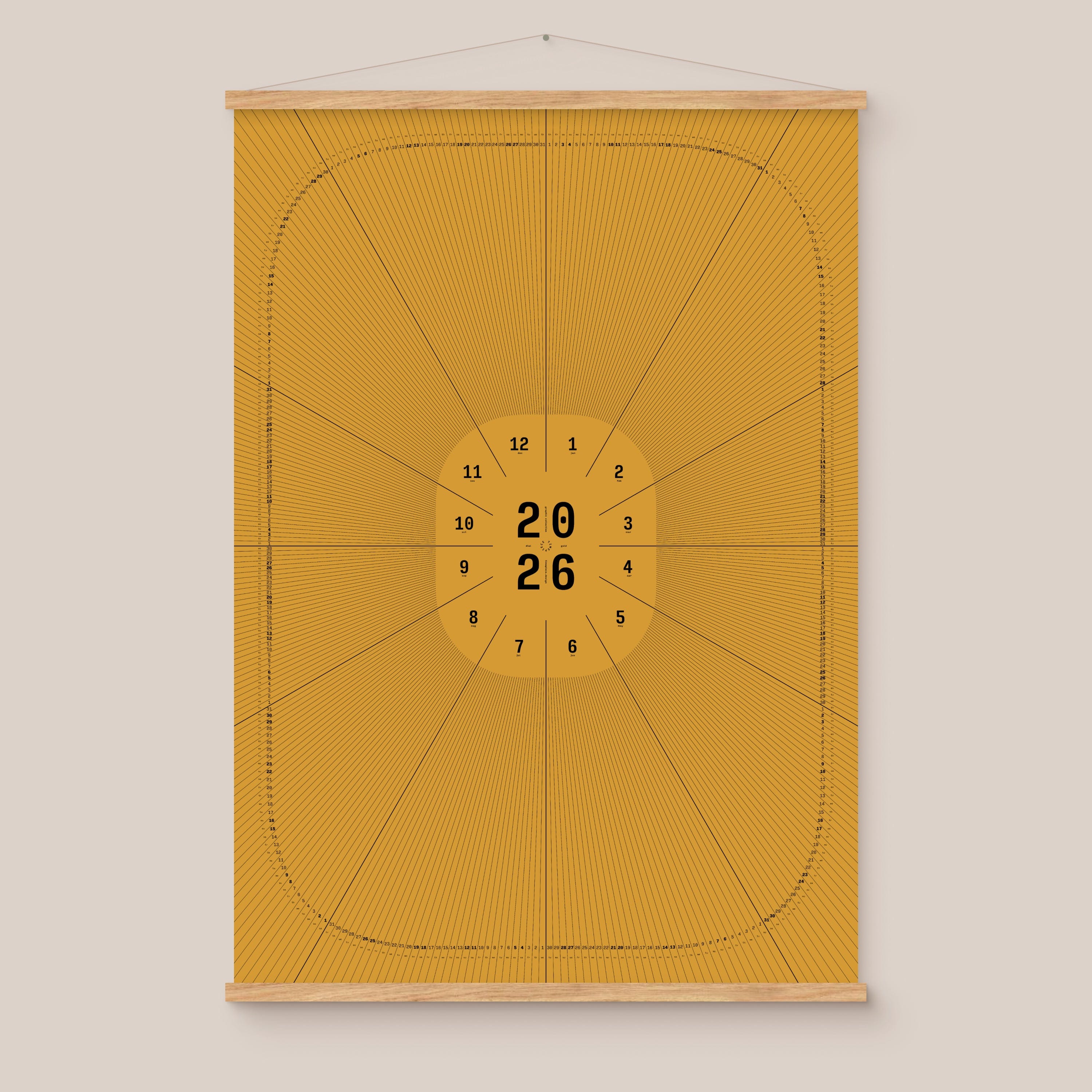 Yellow geometric calendar with a circular design and numbers on a beige wall, natural wooden hanger frame