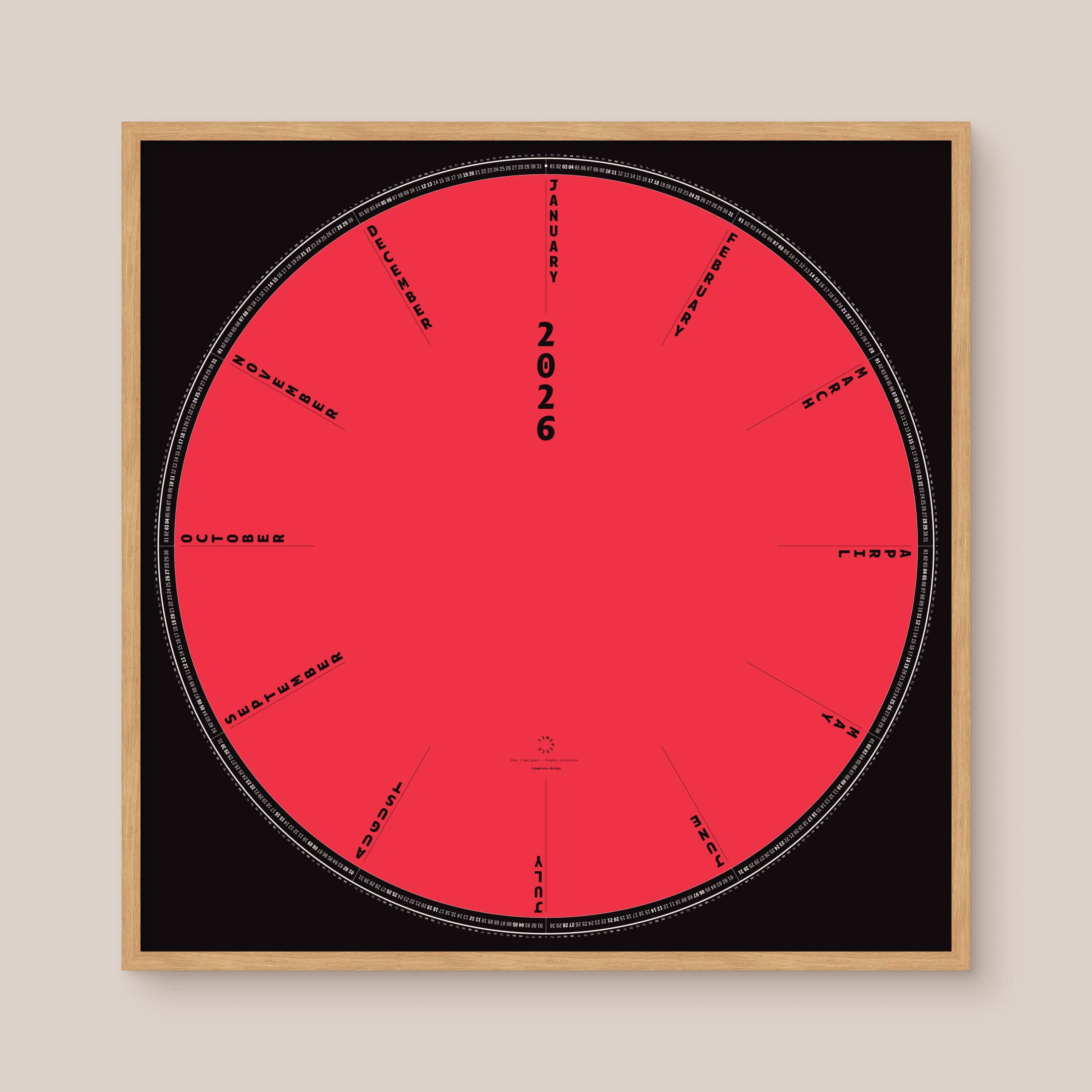Circular red and black calendar with '2026' and text on a beige background, natural wooden frame