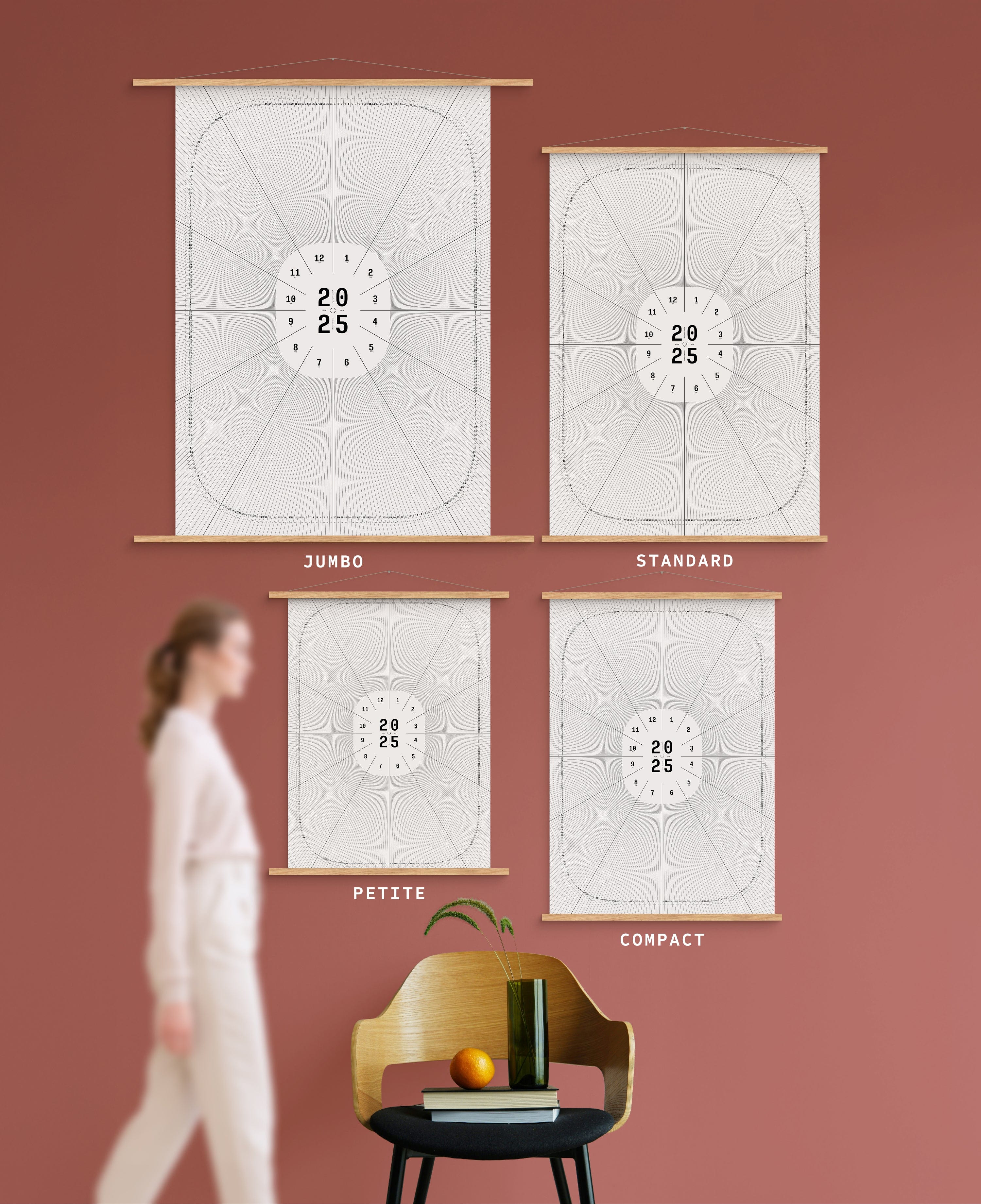 4 sizes of Dial in Porcelain colour calendar on terracotta wall, with person, chair, orange and vase shown for scale
